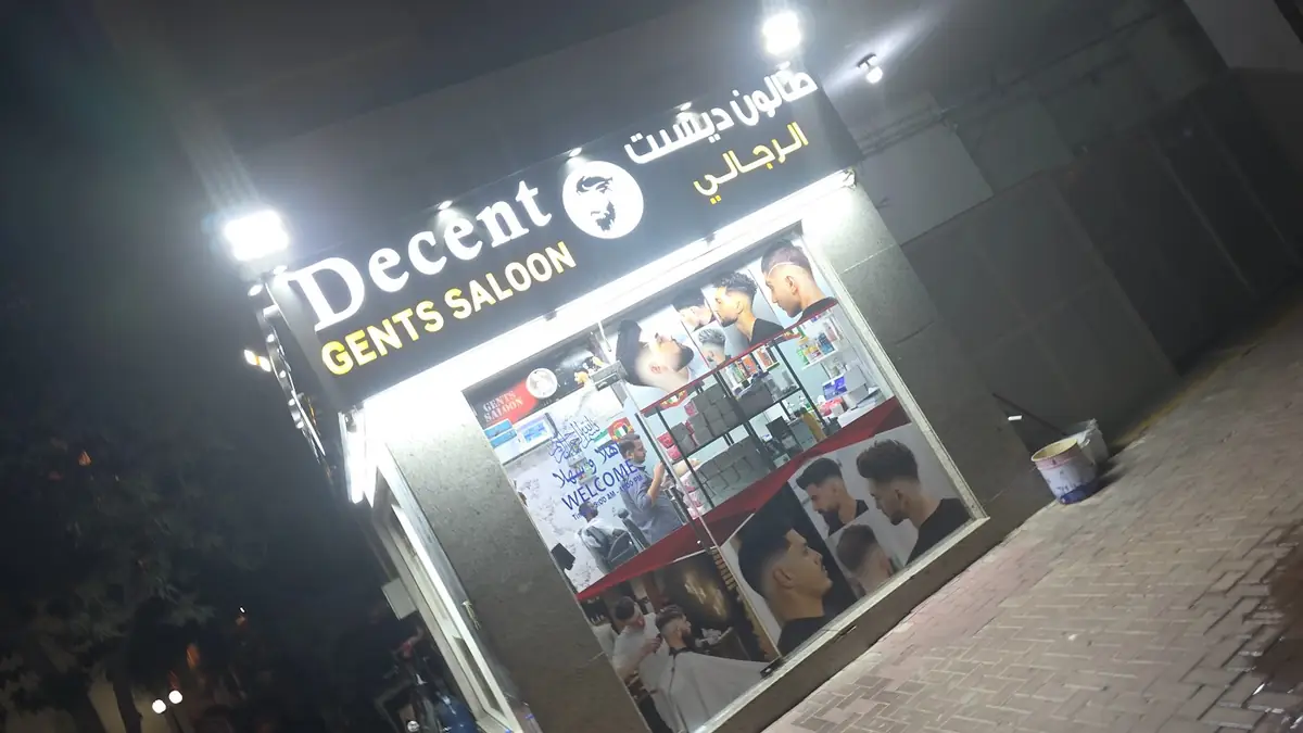 Decent Gents Saloon sign in English and Arabic